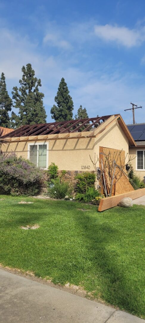 House with damaged roof and solar panels