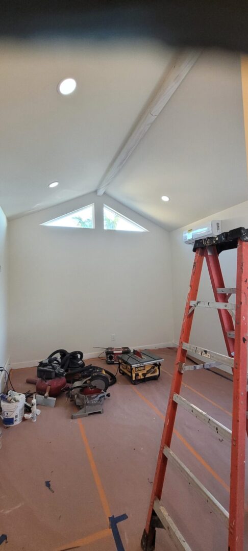 Red ladder in unfinished room