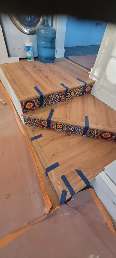 Wooden stairs with decorative tiles