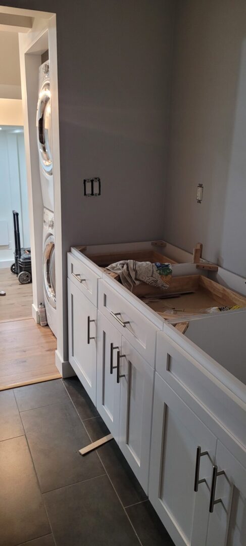Laundry room renovation with stacked machines