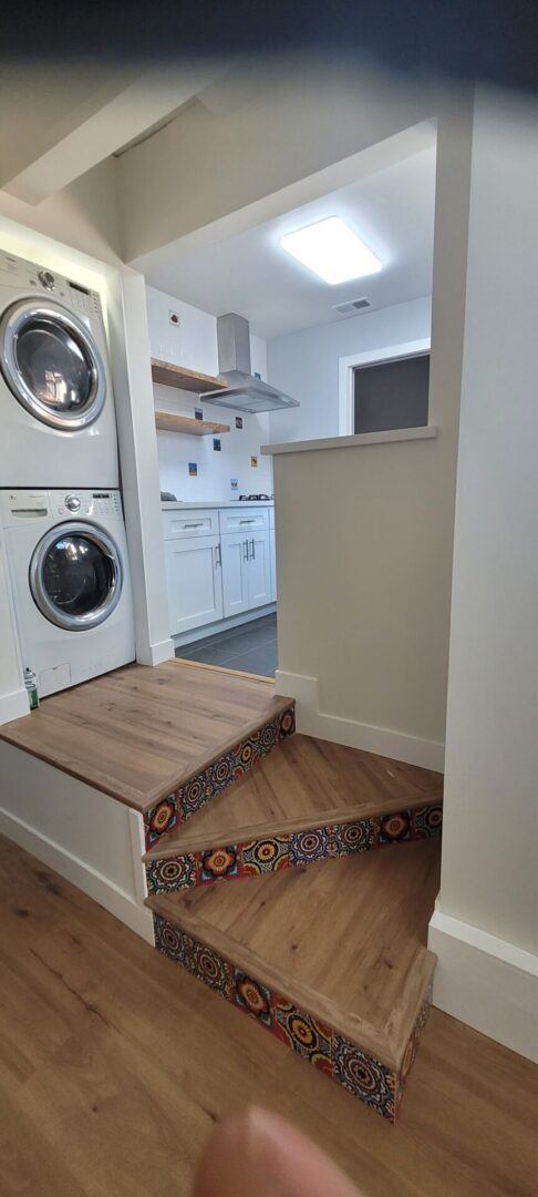 Wooden stairs with colorful tile accents