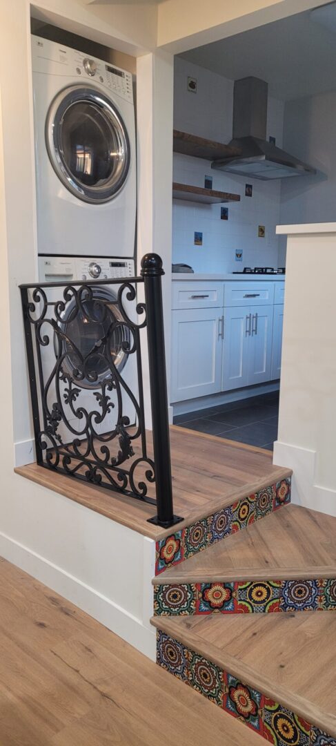 Washer and dryer beside kitchen