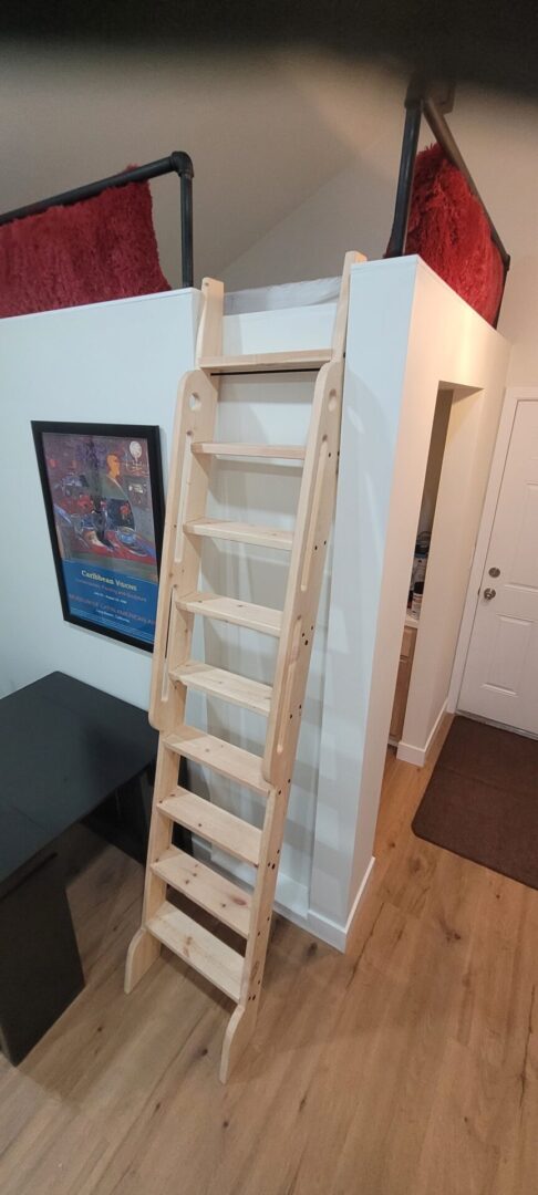 Wooden ladder to loft space